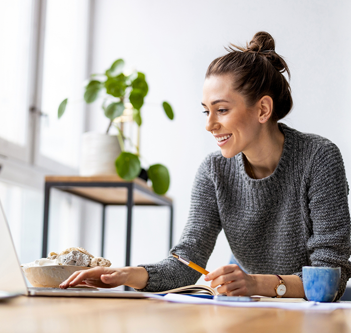 Woman smiling in gray sweater