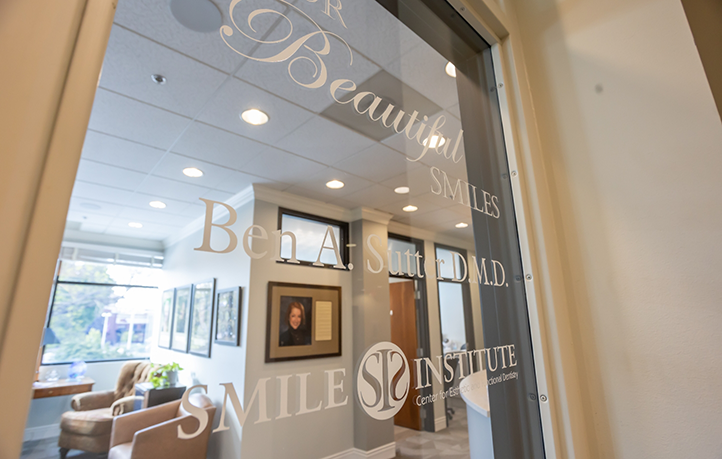 Smile Institute logo on outside of glass door