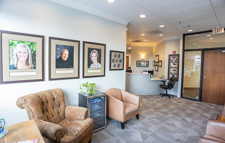 Framed photos on wall of dental office waiting area