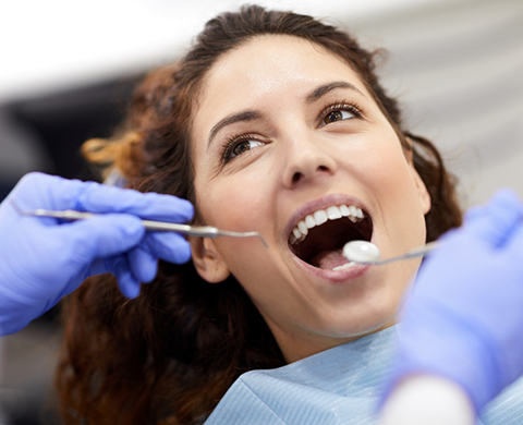 Woman receiving a dental checkup