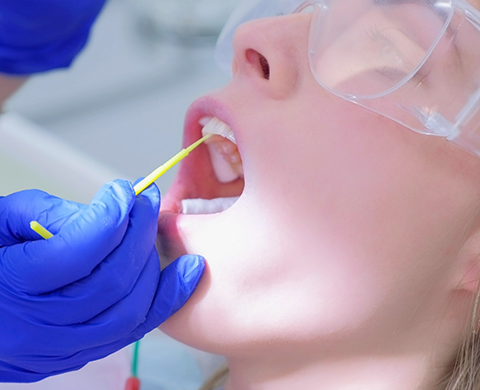 Dental patient having fluoride applied to their teeth