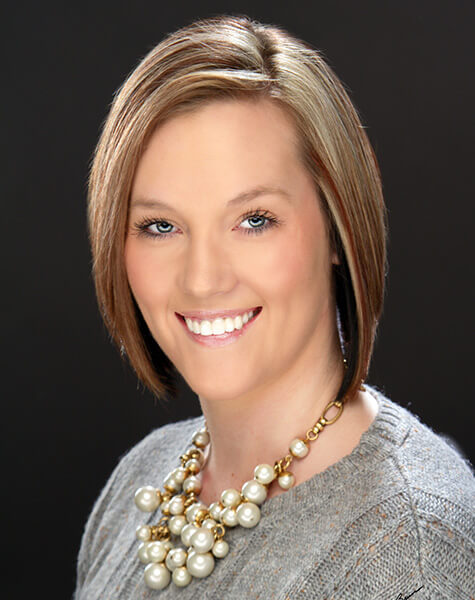 Smiling woman with short brunette bob