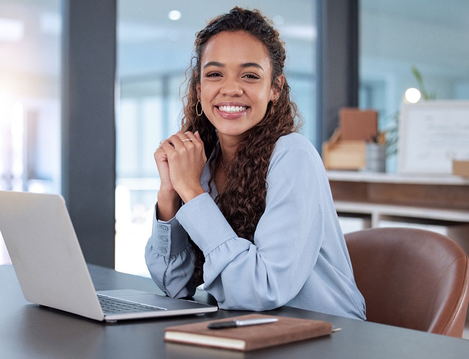 Woman smiling while working in office